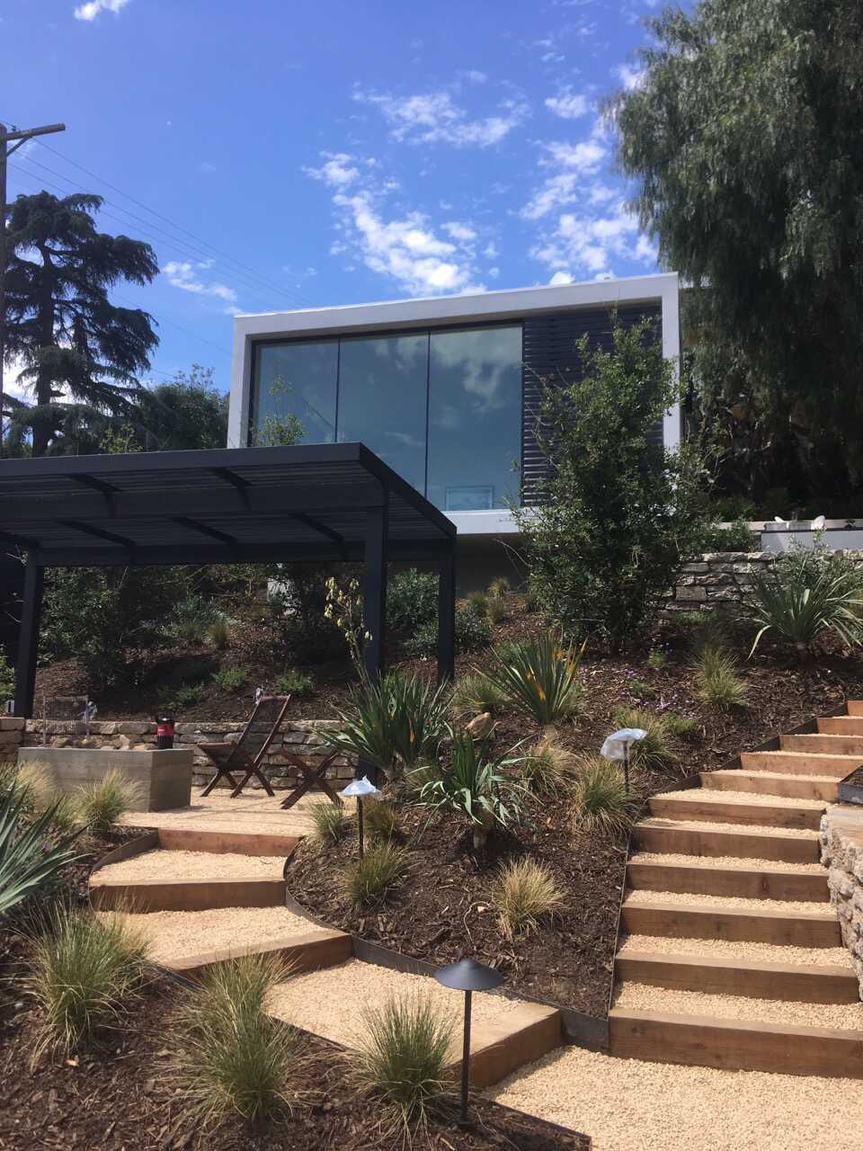 Modern hillside home with large freshly cleaned windows
